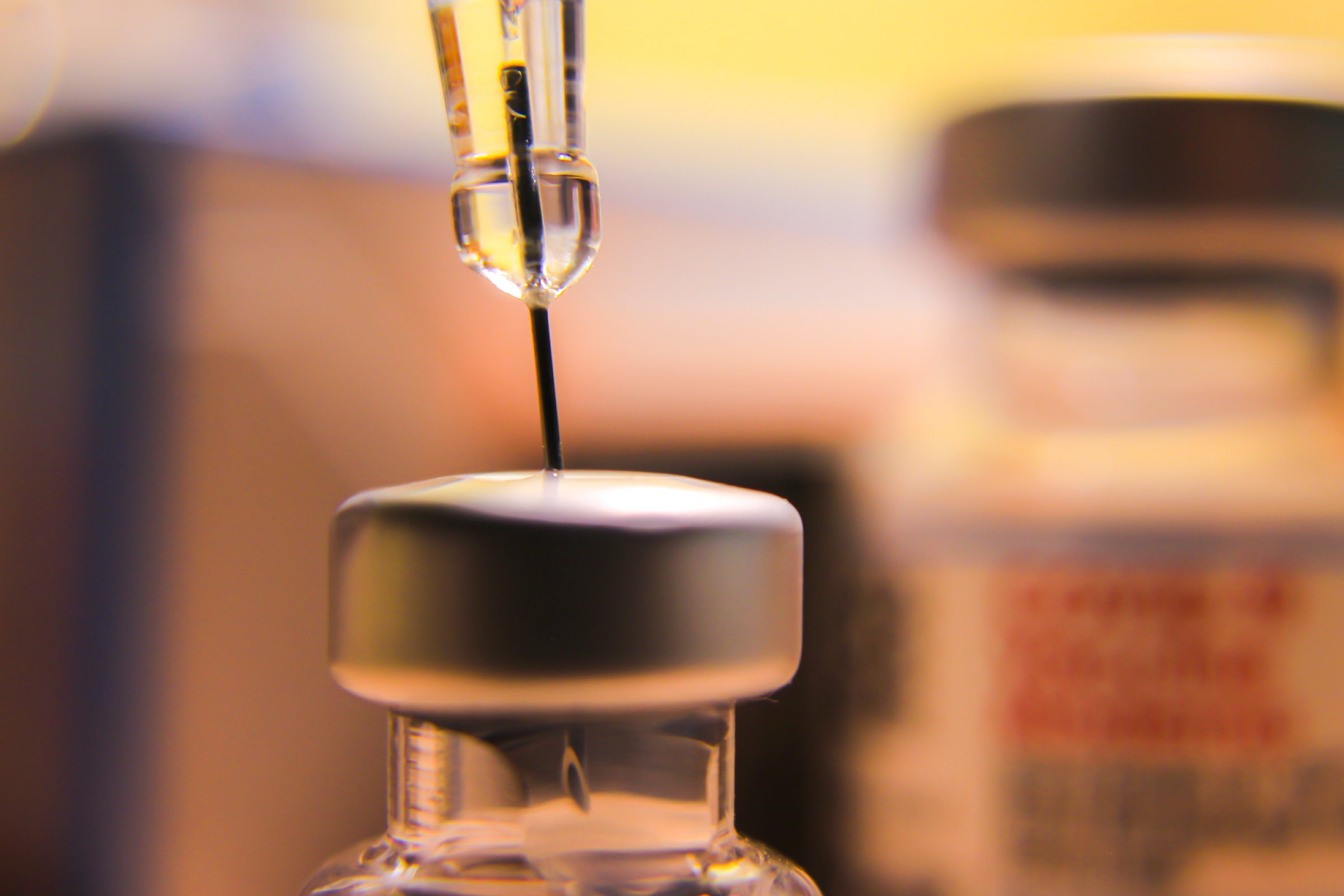 Syringe collecting blood sample representing NAD+ research on inflammation and immune response.