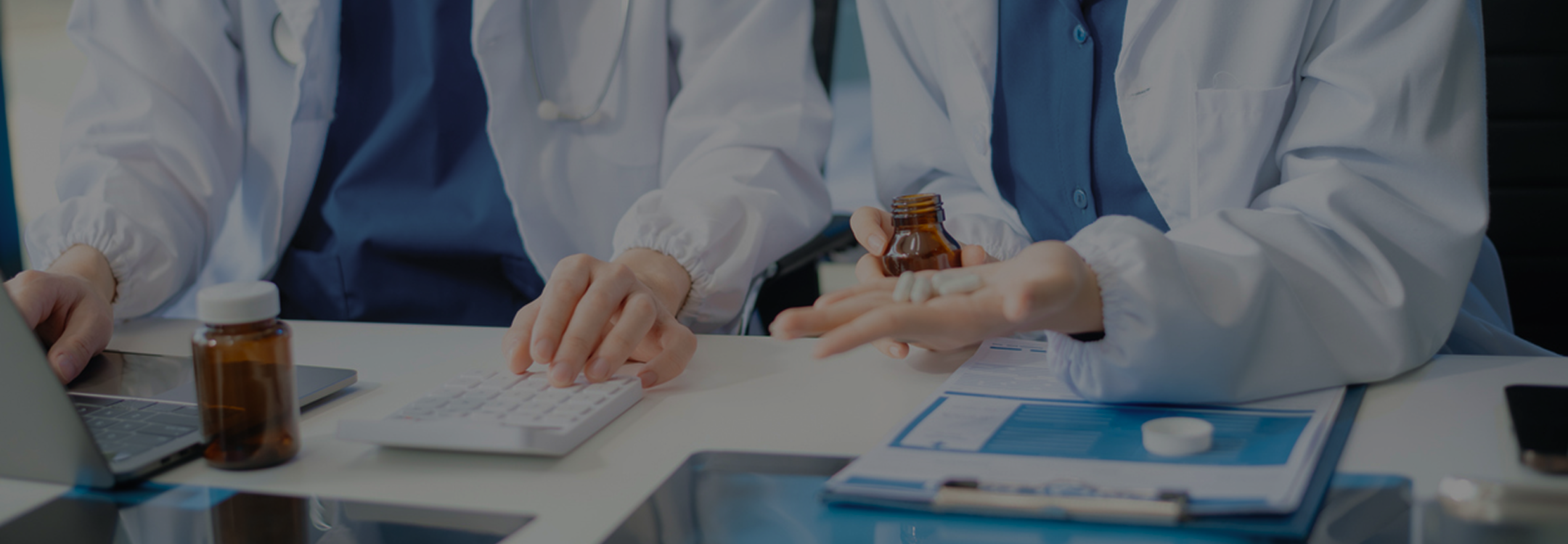 Scientists in lab coats reviewing capsules representing NAD+ and long COVID research.