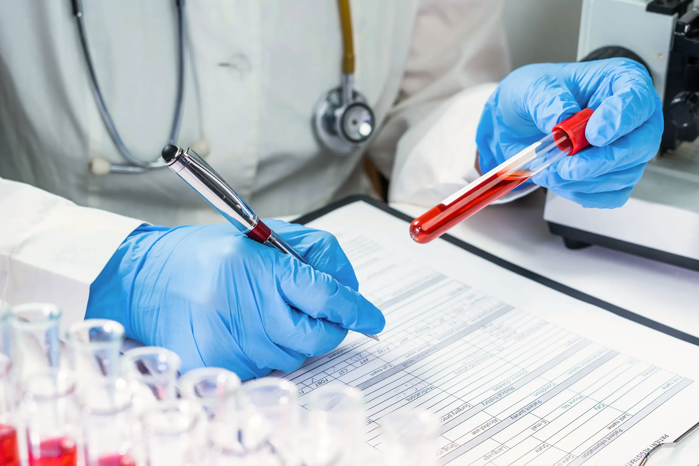 Healthcare professional holding blood collection tubes representing research on blood NAD+ levels, NAD+ decline, and aging.
