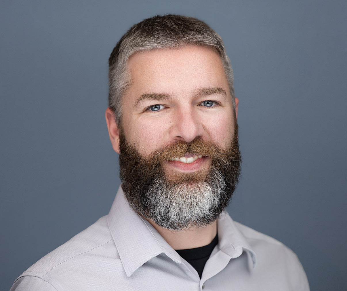 Portrait of Dr. Philip Redpath, Director of Innovation R&D at Niagen Bioscience, expert in synthetic organic chemistry and NAD+ precursor development.