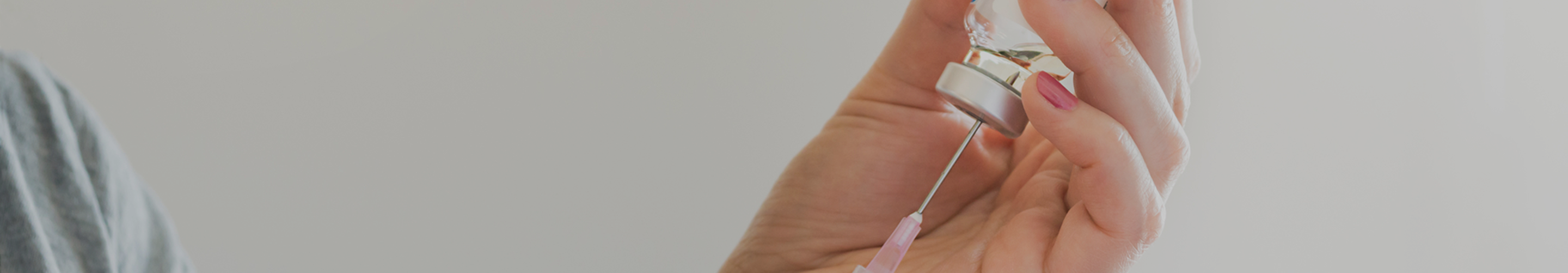 Syringe and vial representing NAD+ and nicotinamide riboside (NR) injections.