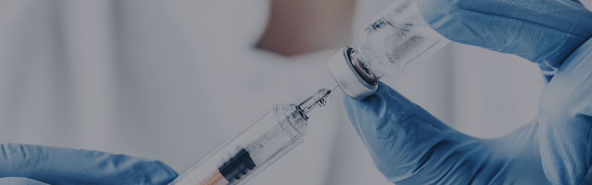 Syringe and vial representing human research on subcutaneous and intramuscular NAD+ injections.