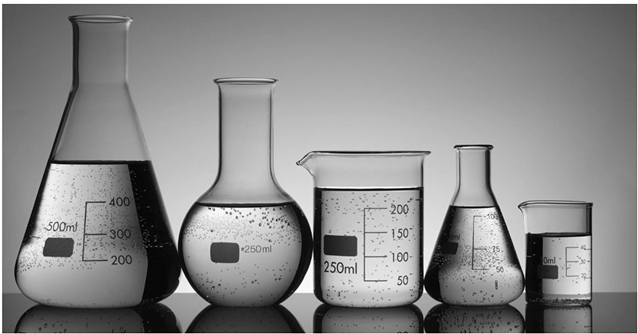 Beakers and laboratory equipment representing Mandel and colleagues' 1963 research on NAD+ chemical breakdown.