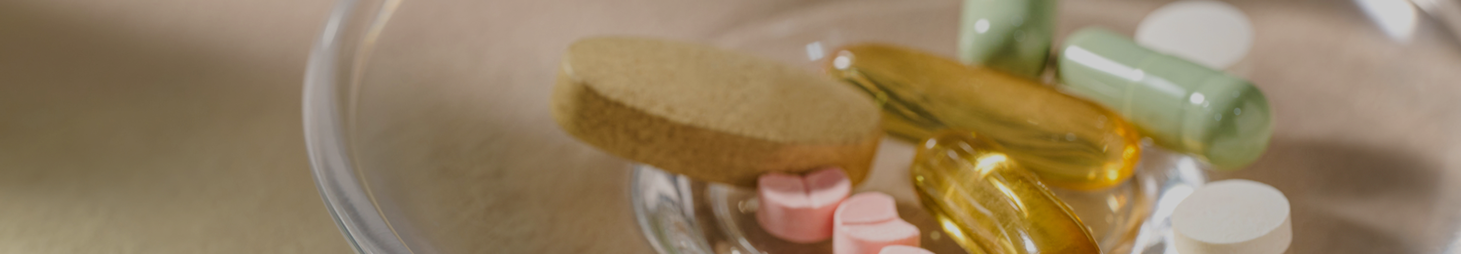 Dish containing capsules symbolizing oral NAD+ and nicotinamide riboside (NR) supplementation.