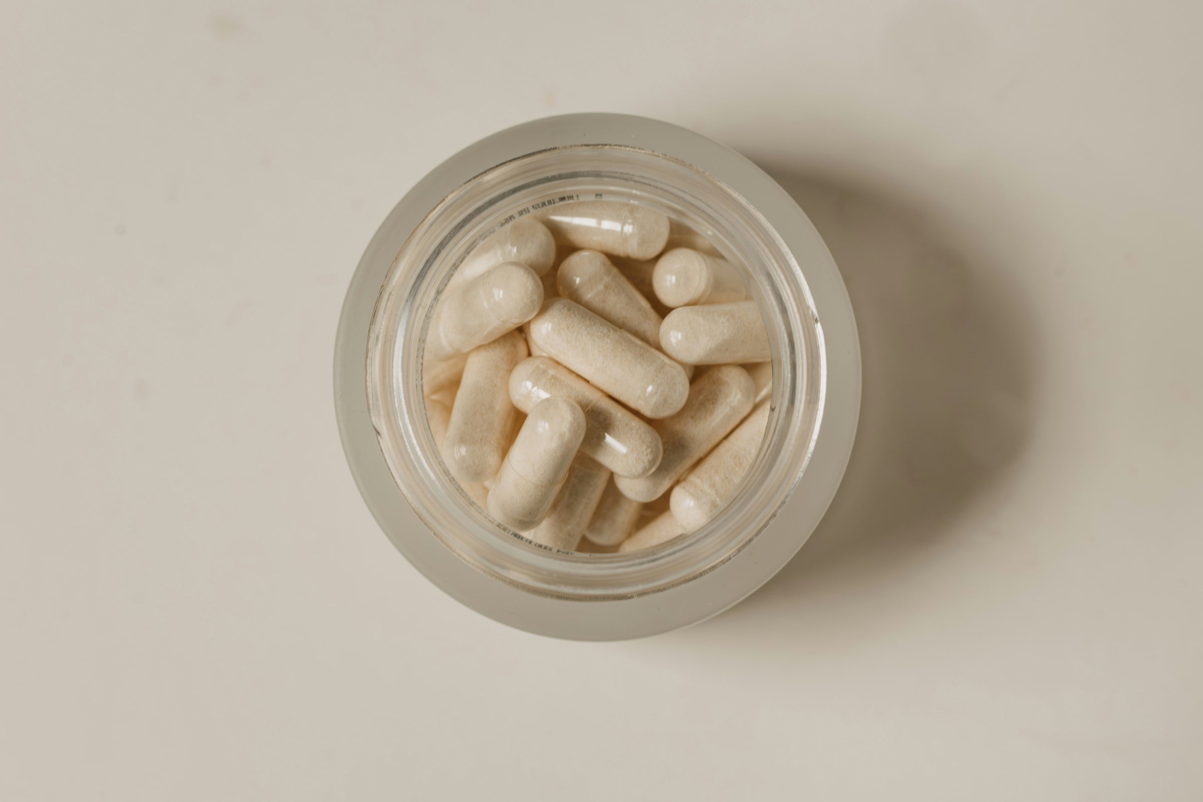 Overhead view of a bottle of vitamin B3 supplements, supporting methylation and overall health.