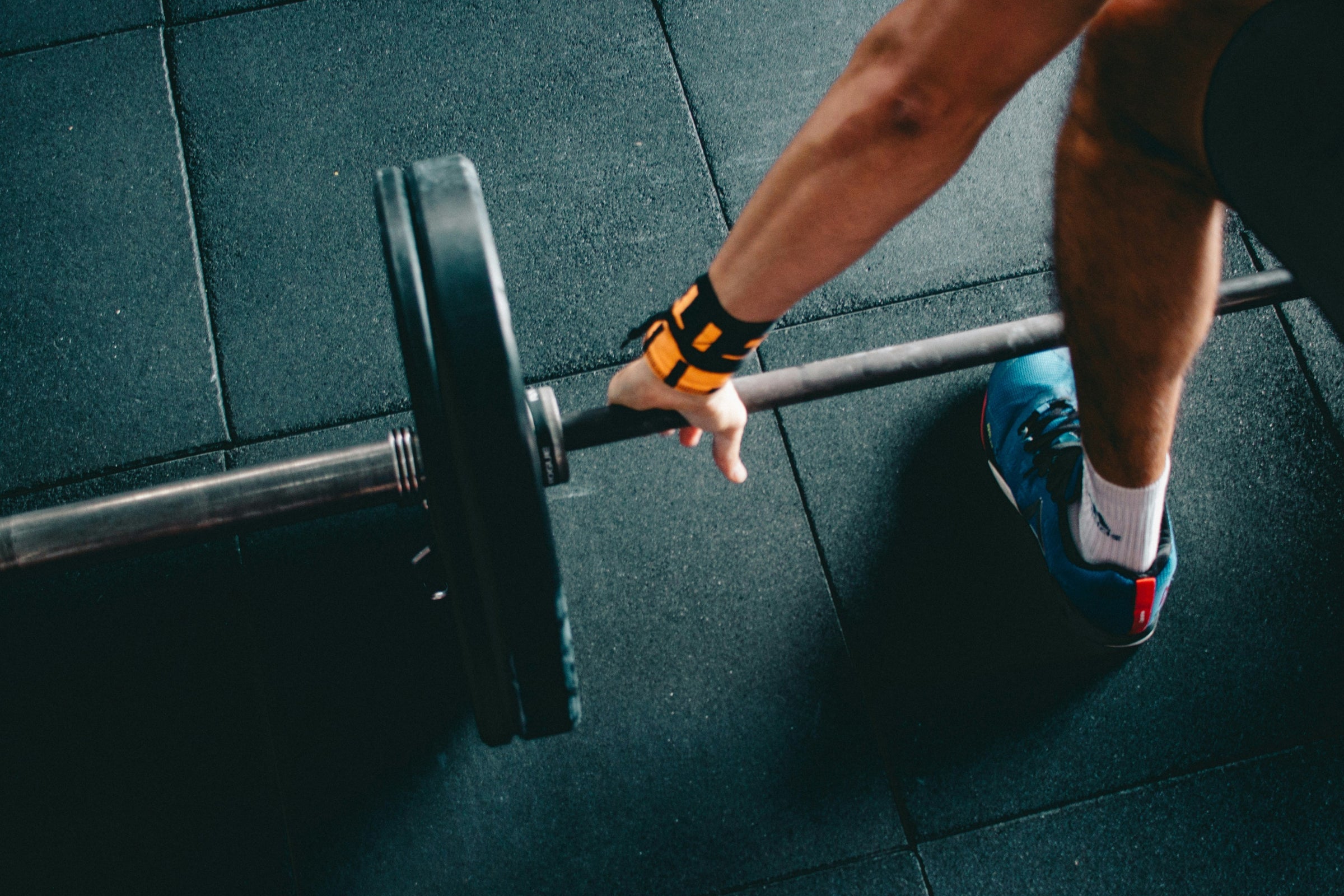 Athlete lifting barbell symbolizing NAD+ research on muscle health.
