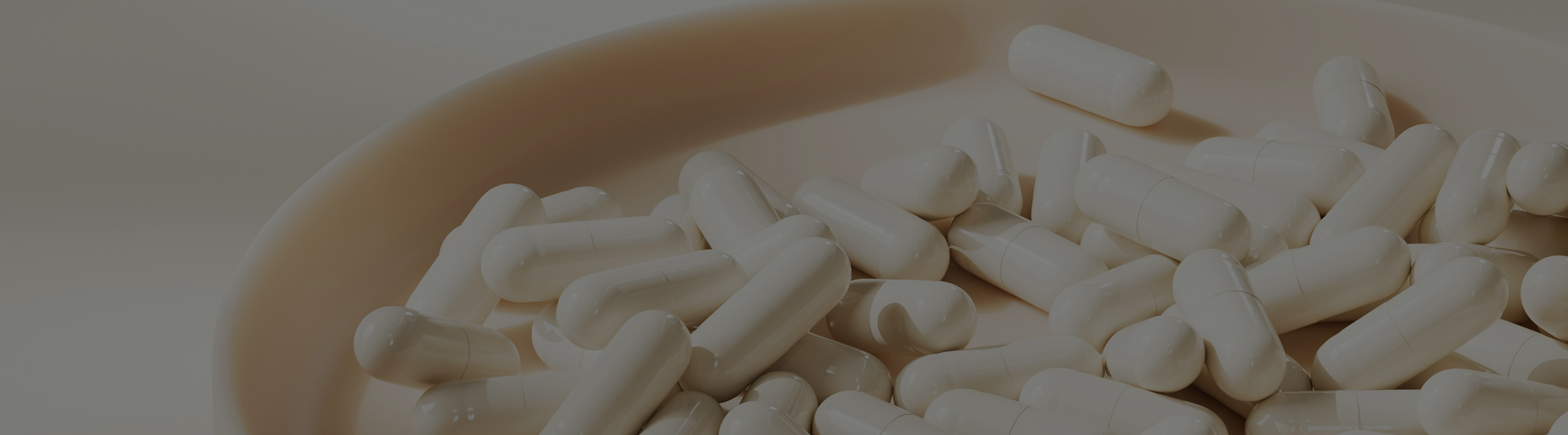 Capsules on a plate representing nicotinamide riboside chloride and USP monograph standards for supplement quality and purity.