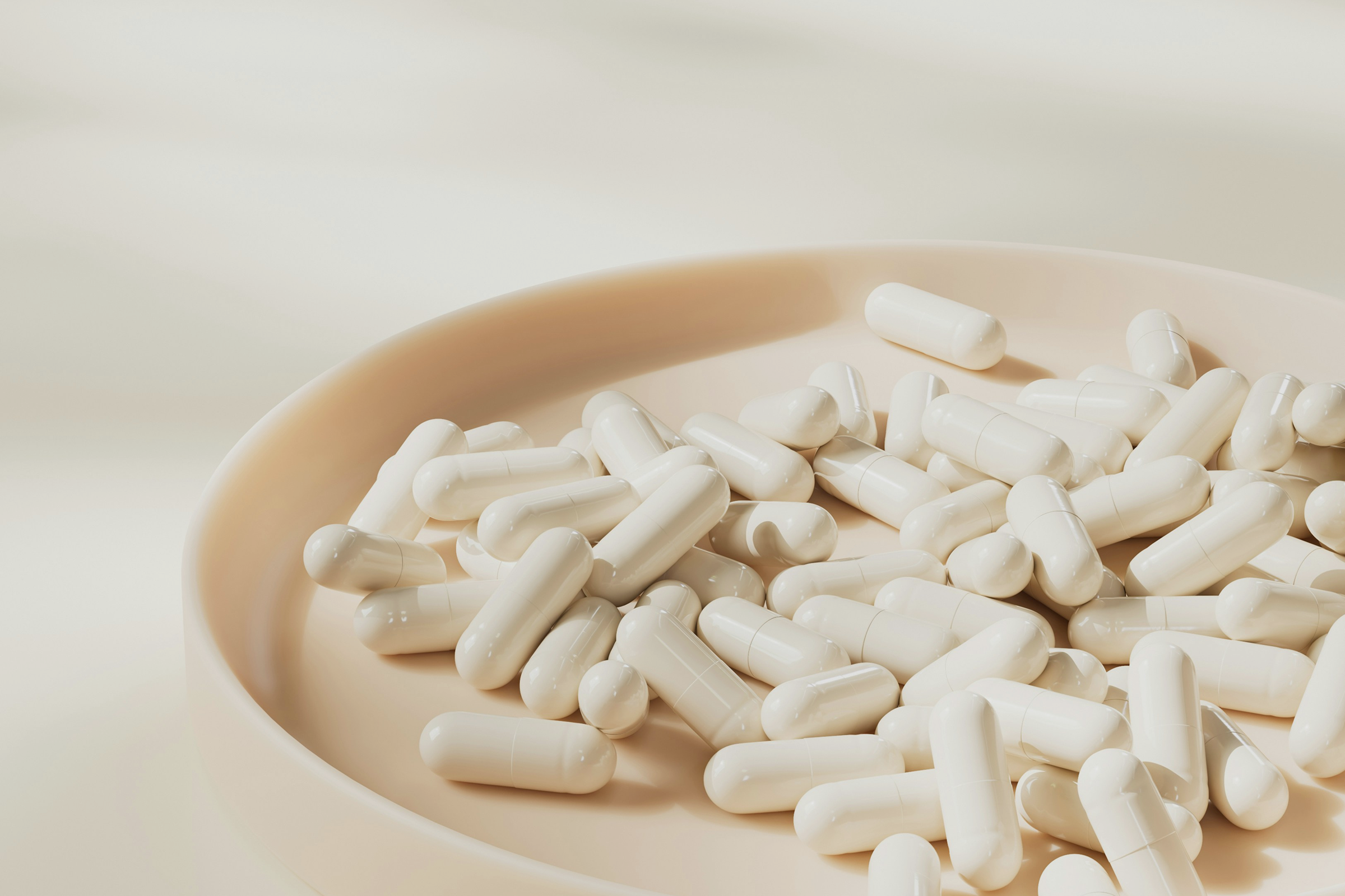Capsules on a plate representing nicotinamide riboside chloride and USP monograph standards for supplement quality and purity.