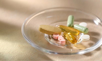 Dish containing capsules symbolizing oral NAD+ and nicotinamide riboside (NR) supplementation.